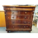 A substantial chest of two over three drawers with upper frieze drawer,