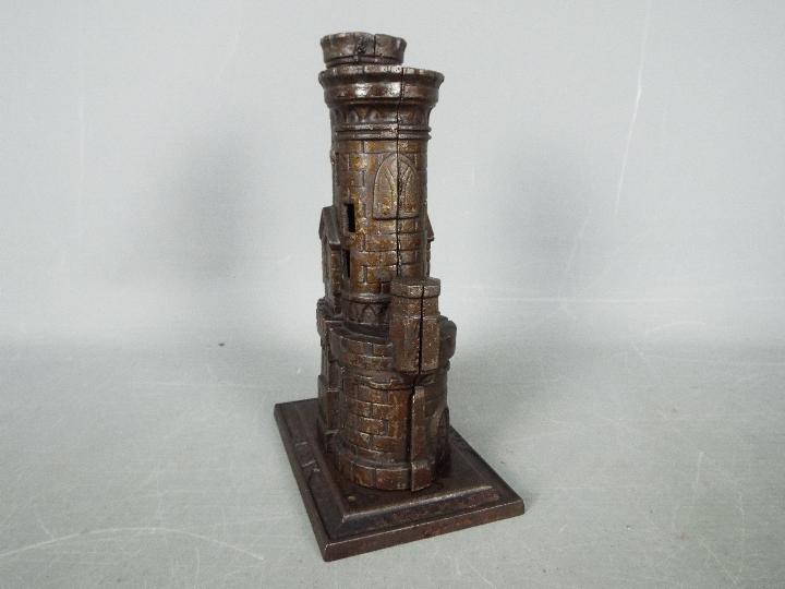 A cast iron, novelty money bank in the form of a castle, marked to the plinth 'Bank', - Image 2 of 6