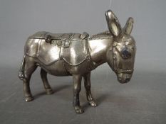 A cast metal money bank in the form of a donkey, marked 'A.S.C.