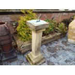 A sundial on reconstituted stone column, 115 cm (h),
