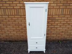 A white bathroom cabinet measuring approximately 142 cm x 54 cm x 38 cm.