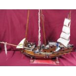 A static wooden model of a Chinese Junk.