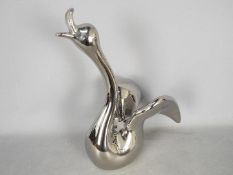 Unused Retail Stock - A boxed ceramic swan with metallic, silver coloured finish,