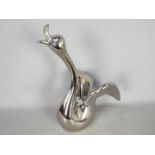 Unused Retail Stock - A boxed ceramic swan with metallic, silver coloured finish,