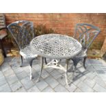 A painted aluminium circular garden table and two chairs [3]