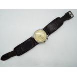 A vintage, military style, wrist worn stopwatch, 37 mm case diameter.