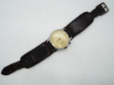 A vintage, military style, wrist worn stopwatch, 37 mm case diameter.