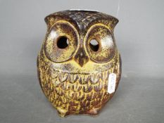 A vintage ceramic money bank in the form of an owl, approximately 14 cm (h).