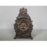 A cast iron money bank, marked 'Our Kitchener Bank, 1914',