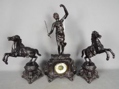 A cast metal mantel clock set, with a matched pair of rearing horses as side pieces, bronzed finish,