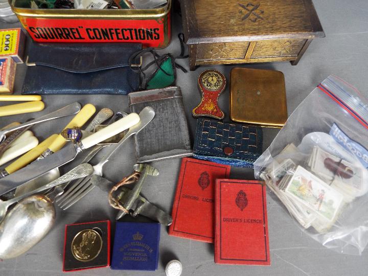 A mixed lot of collectables to include cigarette cards, coins, flatware (some with silver mounts), - Image 4 of 6
