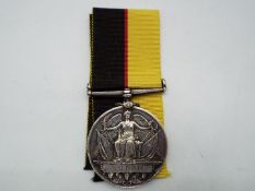 A Queens Sudan Medal (naming partially erased), with ribbon.