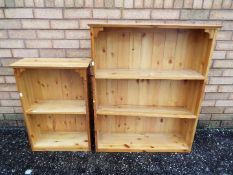 Two freestanding pine bookcases, largest approximately 97 cm x 80 cm x 22 cm.