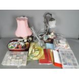 Lot to include sewing and crafting equipment and a quantity of lamps.