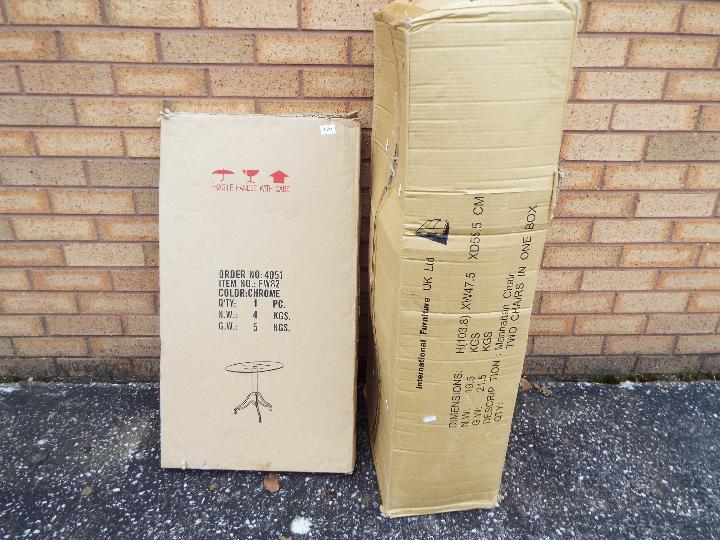 Unused Retail Stock - A box of two oak 'Manhattan' chairs by International Furniture UK Ltd and a