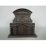 A cast iron, novelty money bank of architectural form,