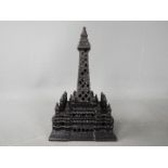 A cast iron money bank in the form of Blackpool Tower, Rd No 449017 to the base,