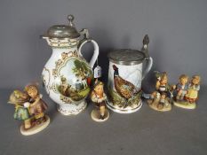 Two Franklin Porcelain lidded steins / jugs and four Hummel figurines.