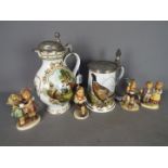 Two Franklin Porcelain lidded steins / jugs and four Hummel figurines.