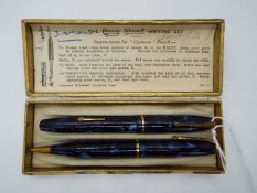 Conway Stewart - A vintage blue marble writing set comprising a Dinkie 550 with 14ct nib and pencil