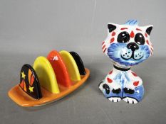 A Lorna Bailey toast rack for Old Ellgreave Pottery and a Lorna Bailey cat figurine 'Tad',