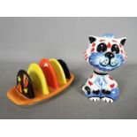 A Lorna Bailey toast rack for Old Ellgreave Pottery and a Lorna Bailey cat figurine 'Tad',