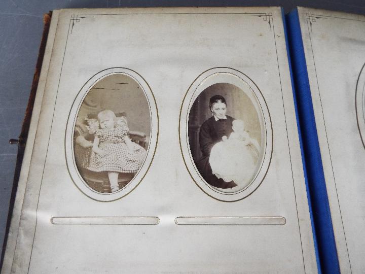 A Victorian, leather bound photograph album with metal clasp, containing photographs. - Image 4 of 10