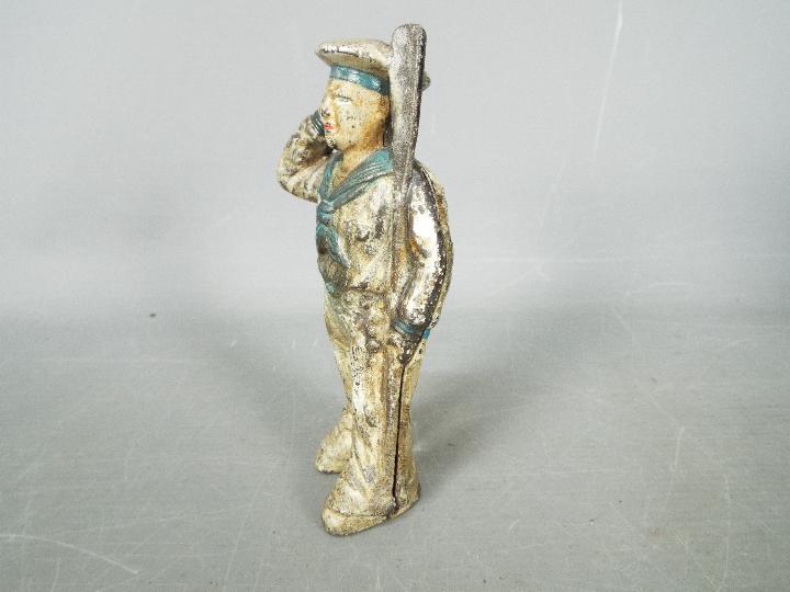 A cold painted, cast iron, novelty money bank in the form of a saluting sailor, - Image 3 of 5