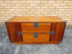 A wooden television stand / cabinet measuring approximately 46 cm x 100 cm x 48 cm