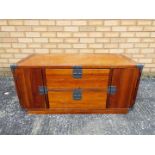 A wooden television stand / cabinet measuring approximately 46 cm x 100 cm x 48 cm