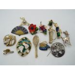 Brooches - fourteen brooches to include a hallmarked silver brooch, enamelled, stone set,