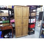 A twin door wardrobe measuring approximately 188 cm x 86 cm x 54 cm.