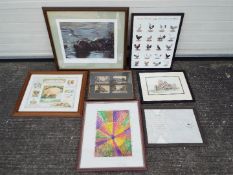 A collection of framed prints and pictures, varying image sizes.