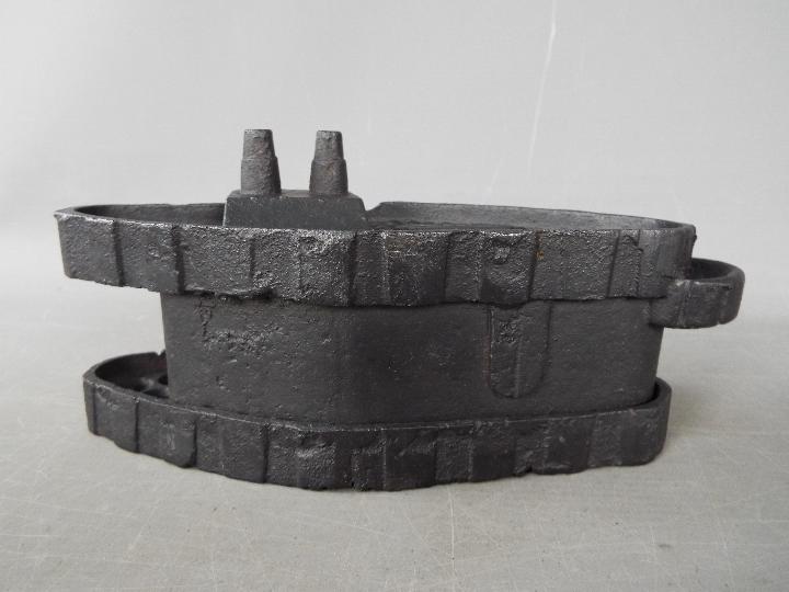 A cast iron money bank in the form of a tank, modelled as a Mark IV Male Tank, marked 'Patent 1918', - Image 5 of 7