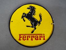 A cast Ferrari sign