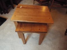 A nest of two tables, largest approximately 53 cm x 53 cm x 42 cm.