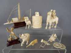 A small collection of early 20th century worked ivory pieces including model of a sampan,