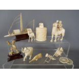 A small collection of early 20th century worked ivory pieces including model of a sampan,