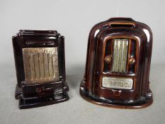 Two Art Deco, cast iron and enamel money banks in the form of stoves,