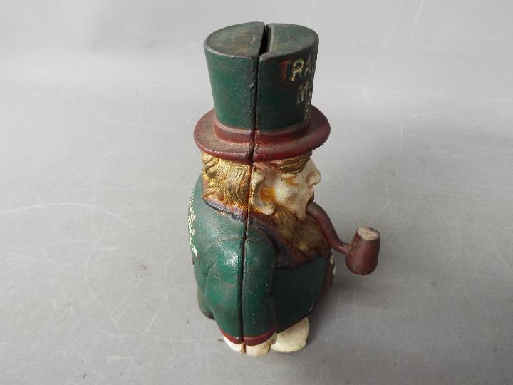 A cast iron 'Transvaal Money Box' in the form of a caricatured President Kruger, - Image 6 of 7