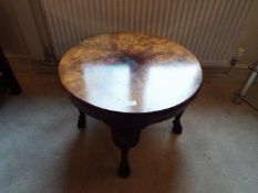 A good quality circular top occasional table on carved supports,