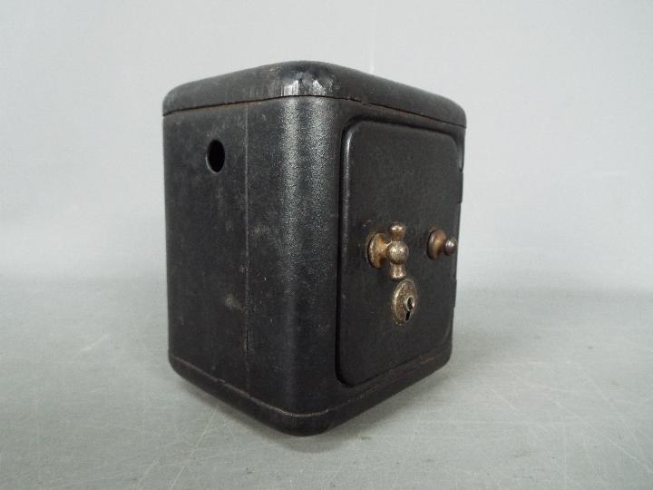 A vintage, novelty money bank in the form of a bank safe, approximately 11 cm (h). - Image 2 of 6