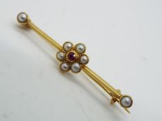 9ct - a 9ct bar brooch, stone set surrounded by pearls, 4cm (l), approx 2.
