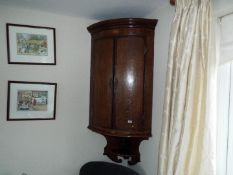 A wall mountable corner unit with inlaid decoration,