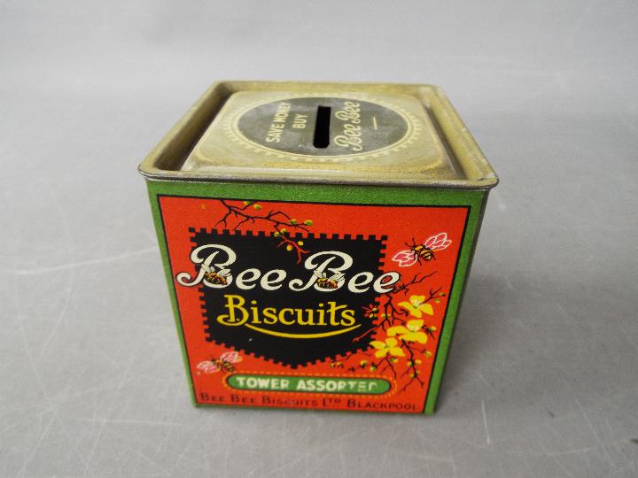 An unusual Bee Bee Biscuits tin money bank,