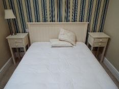A good quality double bed and a pair of bedside cabinets measuring approximately 74 cm x 39 cm x 35