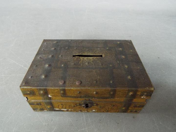 A vintage money bank / tin in the form of a metal bound chest, - Image 2 of 4