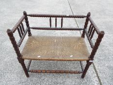 A small scale, twin bench seat with bobbin turned supports,