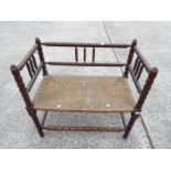 A small scale, twin bench seat with bobbin turned supports,