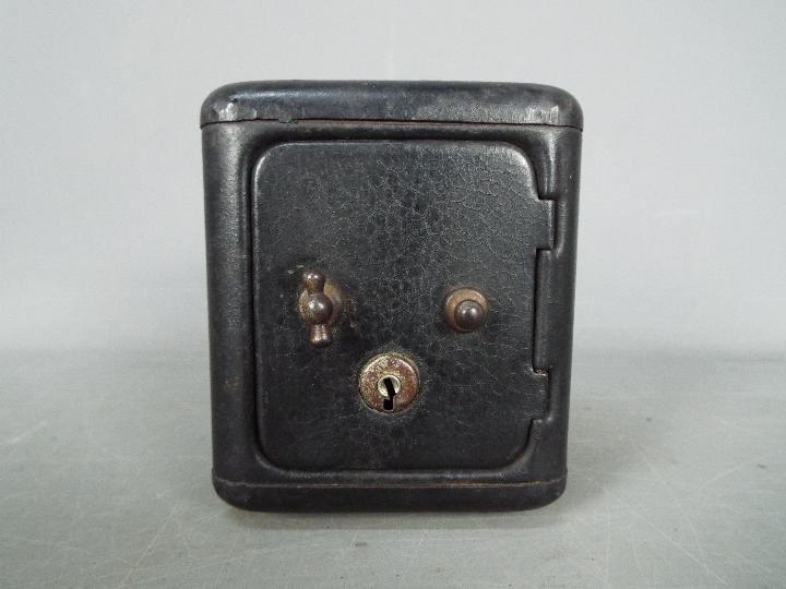 A vintage, novelty money bank in the form of a bank safe, approximately 11 cm (h).